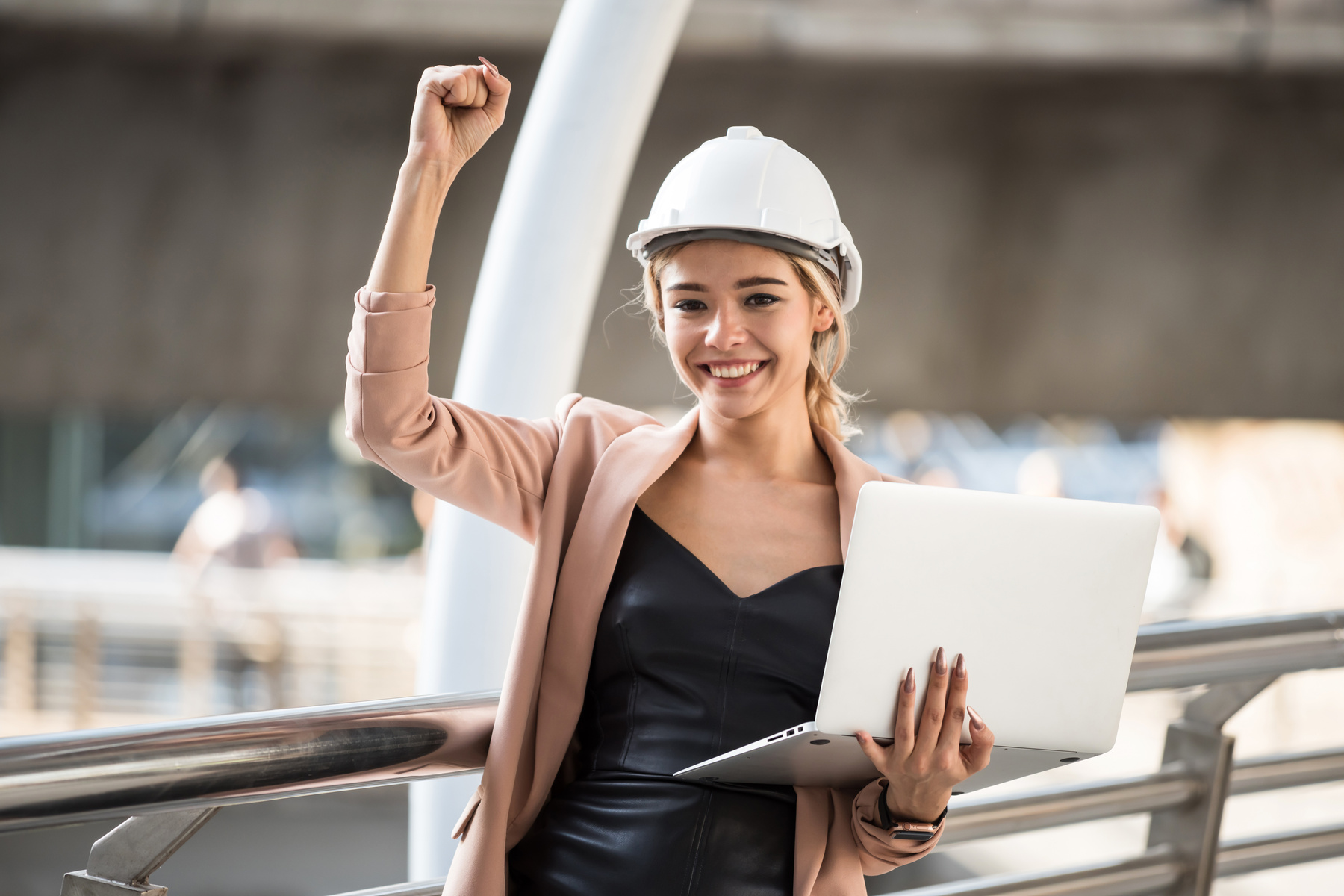 Beautiful engineer celebrate construction project